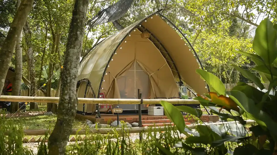 The Nest glamping tent surrounded by nature at Suka Camping